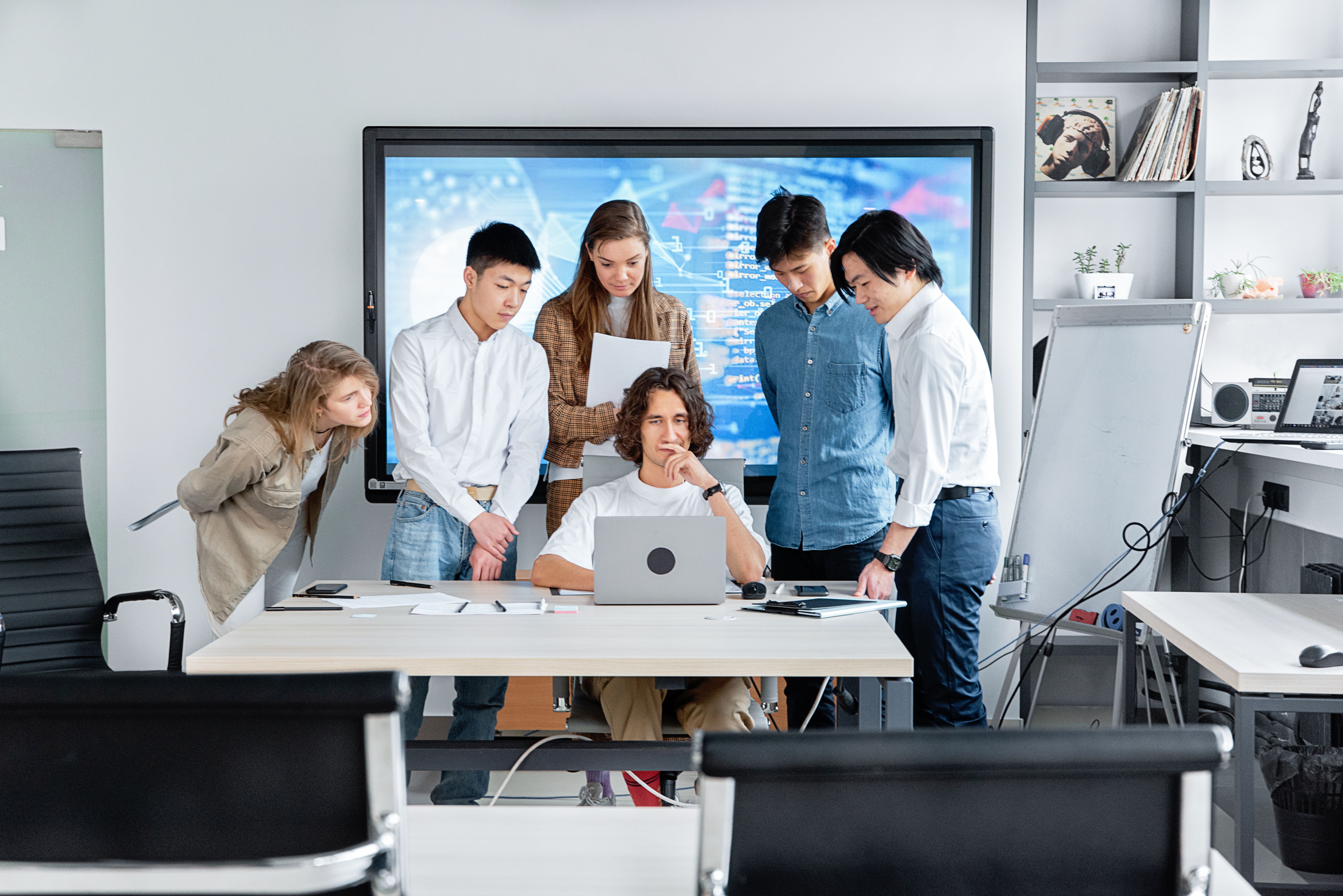 Team collaborating on a software project proposal